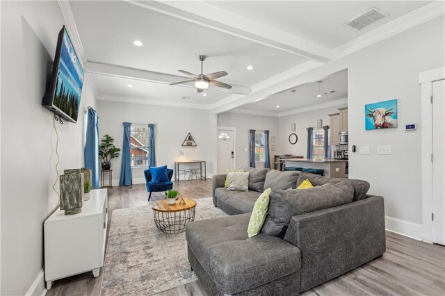 906 Sims St SW, Atlanta, GA 30603 - living room with a ceiling fan, beam ceiling, wood finished floors, and visible vents