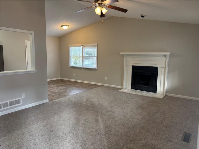 unfurnished living room featuring ceiling fan, lofted ceiling, and carpet flooring