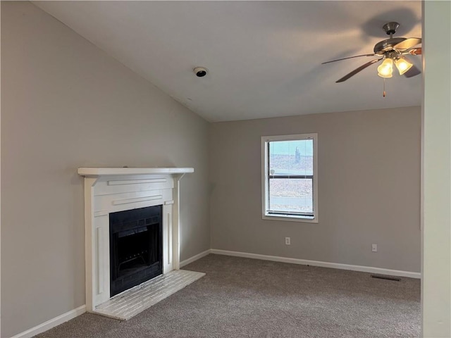 unfurnished living room with ceiling fan, carpet, and lofted ceiling