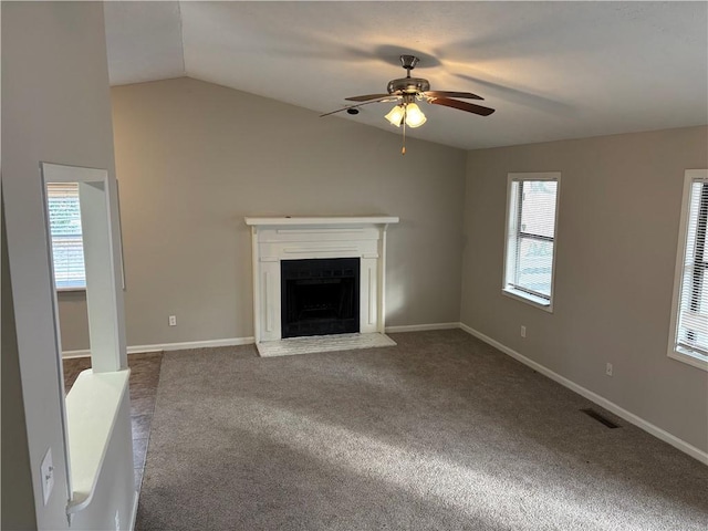 unfurnished living room with carpet floors, ceiling fan, and vaulted ceiling