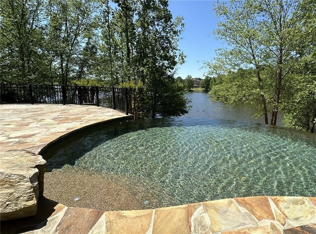 property view of water with fence