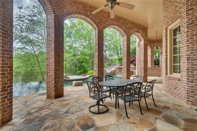 view of patio / terrace featuring a ceiling fan and outdoor dining space