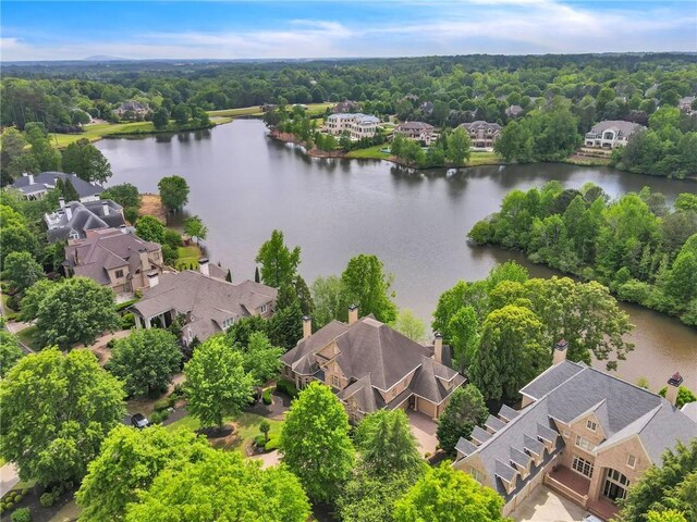 bird's eye view featuring a water view and a residential view