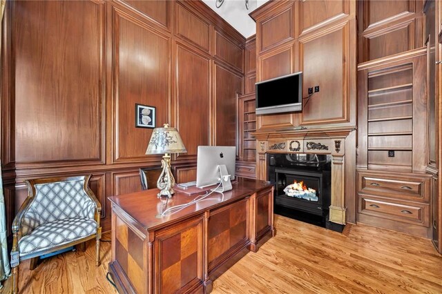 living area featuring baseboards, marble finish floor, and ornate columns