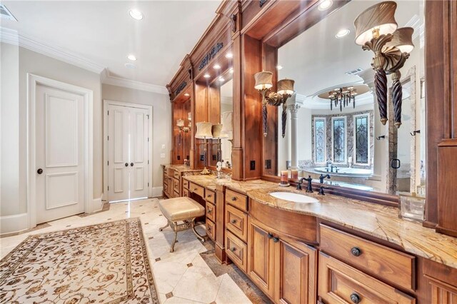 bathroom featuring a garden tub, decorative columns, ornamental molding, a shower stall, and baseboards