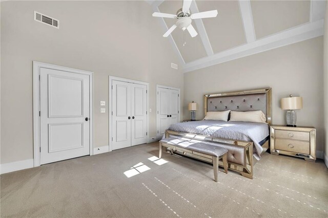 corridor with light wood-type flooring, an inviting chandelier, a tray ceiling, and crown molding