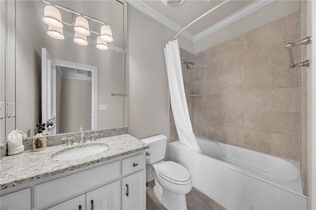 full bath featuring toilet, shower / bath combo, vanity, and crown molding