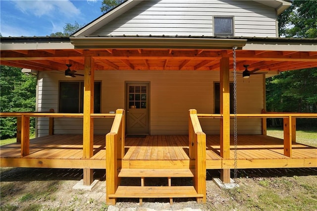 exterior space featuring ceiling fan and a deck