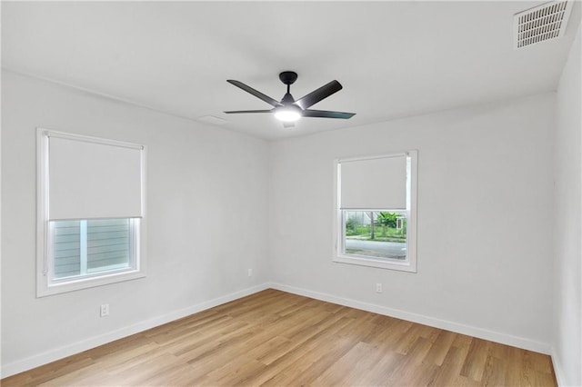 unfurnished room featuring ceiling fan and light hardwood / wood-style flooring