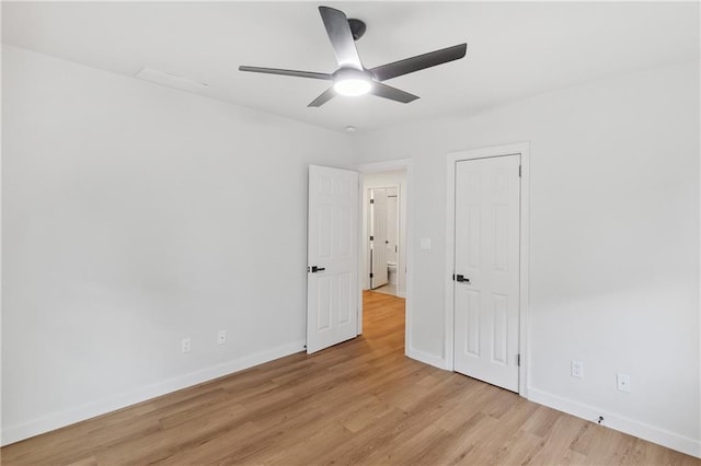 unfurnished bedroom with ceiling fan and light hardwood / wood-style flooring