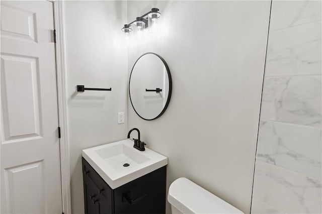 bathroom with vanity and toilet