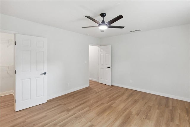 spare room with ceiling fan and light hardwood / wood-style flooring