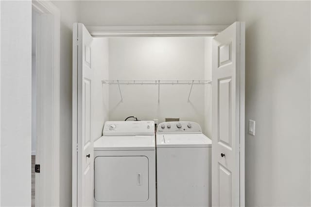 laundry room featuring washing machine and dryer