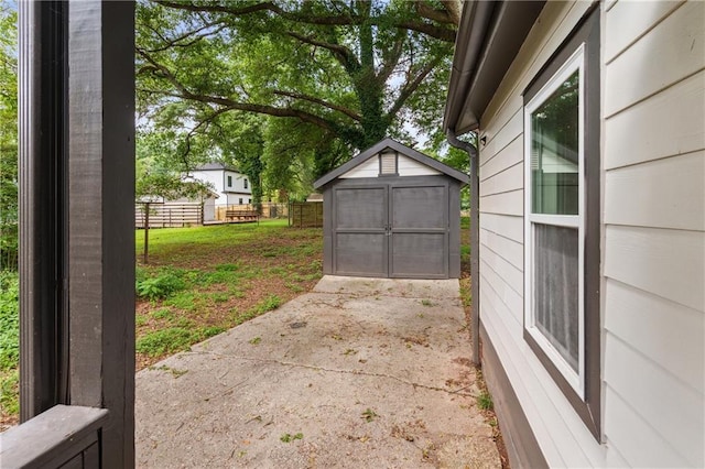 view of patio featuring a storage shed