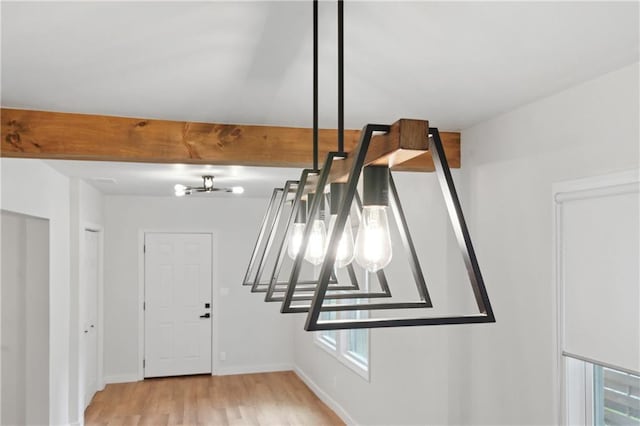 room details featuring hardwood / wood-style flooring, a notable chandelier, and beamed ceiling