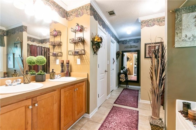 bathroom featuring ornamental molding, visible vents, a sink, and double vanity