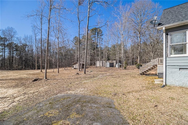 view of yard featuring stairway