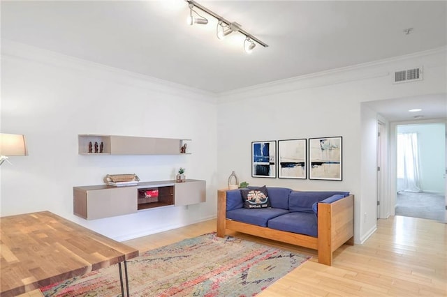 200 Renaissance Pkwy NE Unit 219, Atlanta, GA 30308 - living room with ornamental molding, track lighting, and wood finished floors