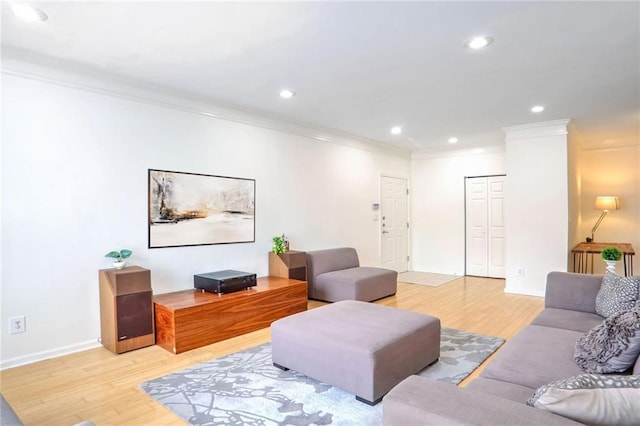 200 Renaissance Pkwy NE Unit 219, Atlanta, GA 30308 - living room with crown molding, light wood-type flooring, and recessed lighting
