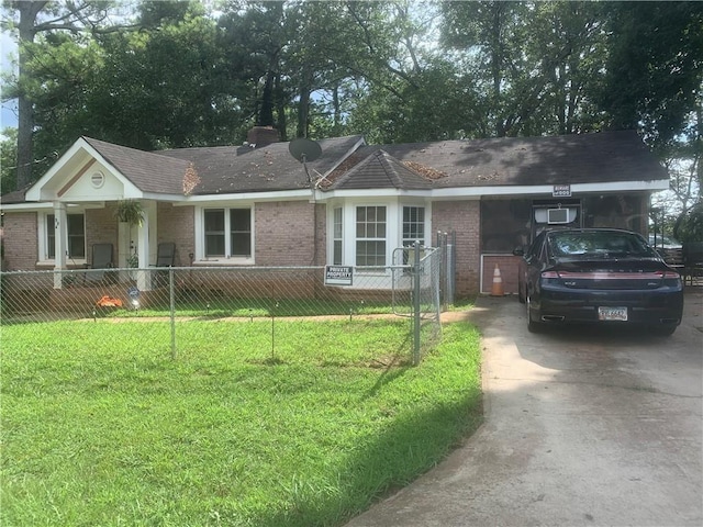 single story home featuring a front yard and a carport