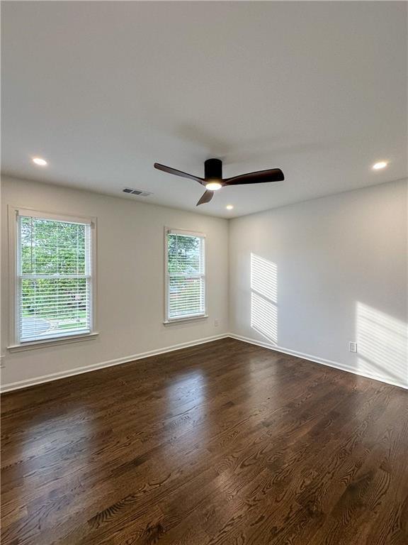 365 Morning Dew Cir, Roswell, GA 30075 - unfurnished room with healthy amount of natural light, dark wood-style floors, ceiling fan, and recessed lighting