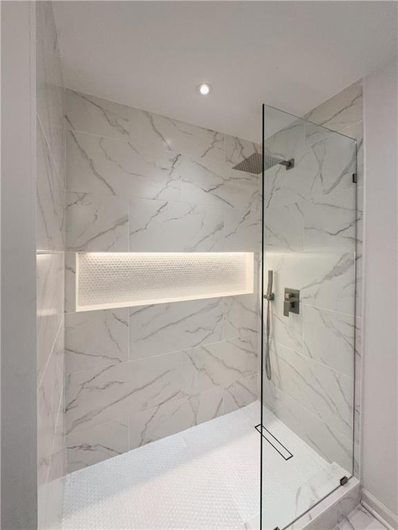 365 Morning Dew Cir, Roswell, GA 30075 - full bathroom featuring a marble finish shower, recessed lighting, and marble finish flooring