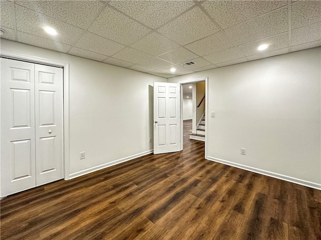 365 Morning Dew Cir, Roswell, GA 30075 - finished below grade area featuring a drop ceiling, dark wood-type flooring, baseboards, stairs, and recessed lighting