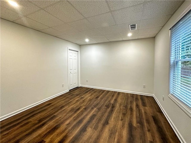 365 Morning Dew Cir, Roswell, GA 30075 - empty room with dark wood-style flooring, a paneled ceiling, baseboards, and recessed lighting