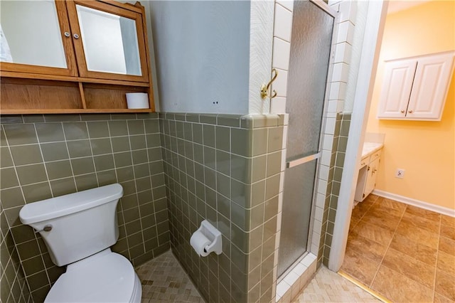 full bath featuring a shower stall, toilet, vanity, and tile patterned flooring