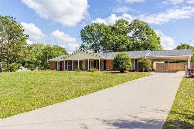 ranch-style home with driveway and a carport