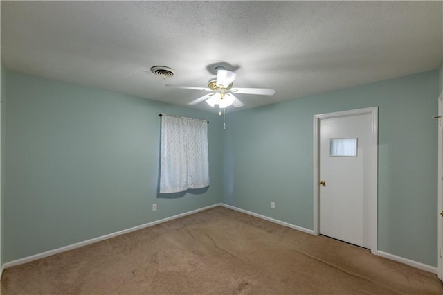 unfurnished room featuring ceiling fan, carpet flooring, and baseboards