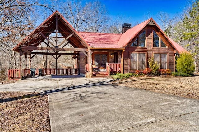 cabin featuring a porch