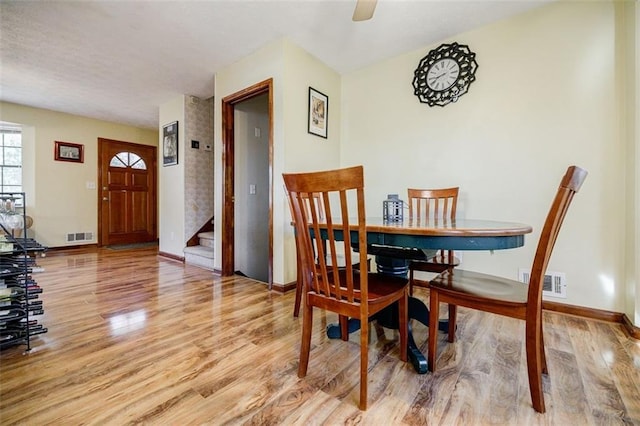 dining space featuring ceiling fan and light hardwood / wood-style flooring