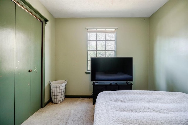 bedroom with carpet floors and a closet