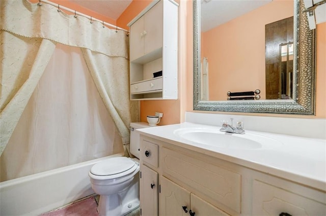 full bathroom with vanity, shower / tub combo, and toilet