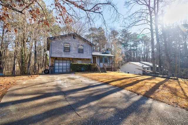 view of front of house featuring a garage and a porch