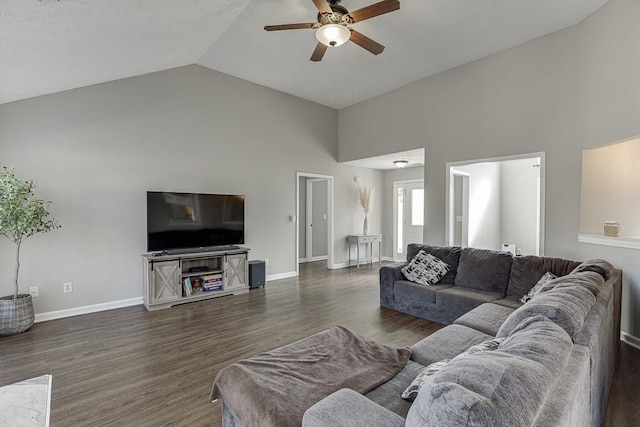 living room featuring ceiling fan, high vaulted ceiling, and dark wood-type flooring