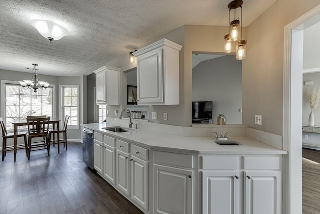 kitchen with white cabinetry, sink, dishwasher, and pendant lighting