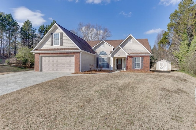 view of front of house featuring a garage and a storage shed