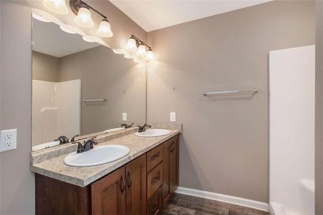 bathroom with hardwood / wood-style floors and vanity