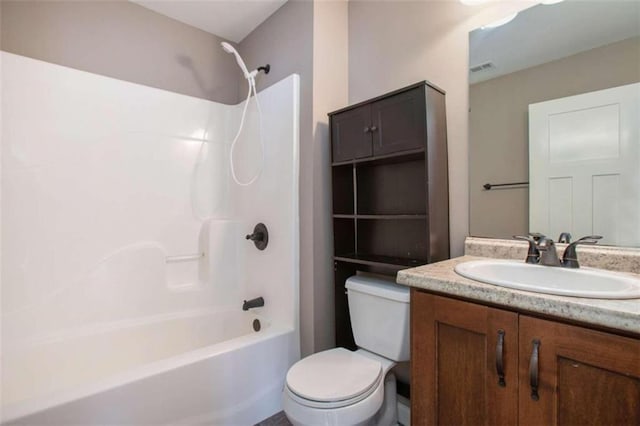 full bathroom with washtub / shower combination, vanity, and toilet