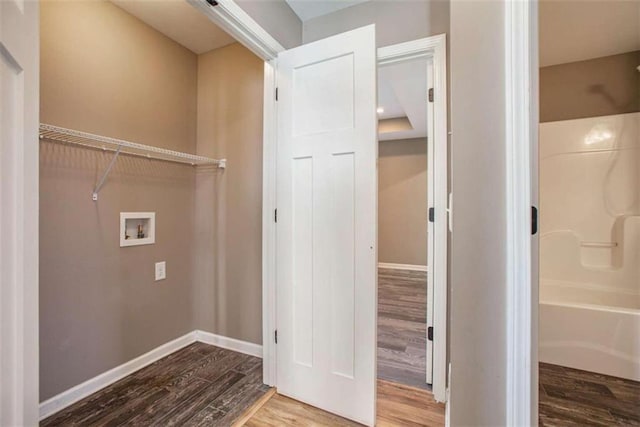 laundry area with washer hookup and hardwood / wood-style floors