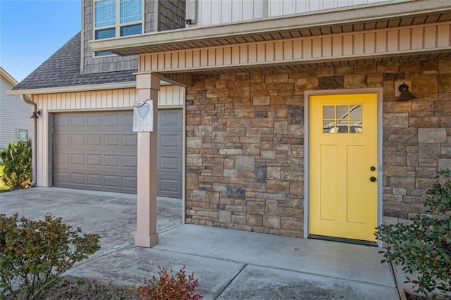 property entrance with a garage