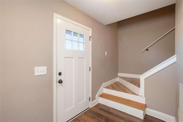 foyer entrance with dark hardwood / wood-style flooring