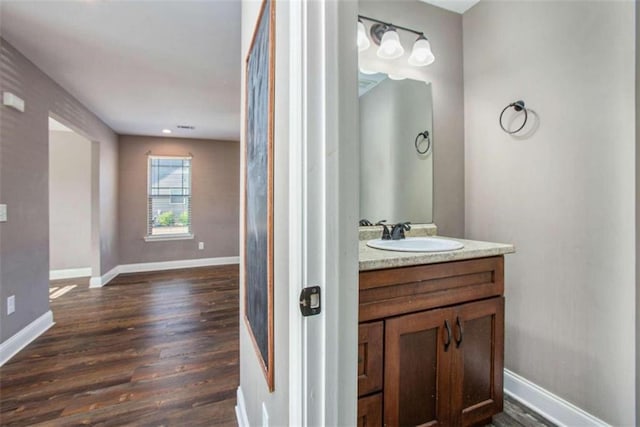 bathroom featuring vanity and hardwood / wood-style floors