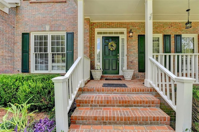 doorway to property featuring a porch