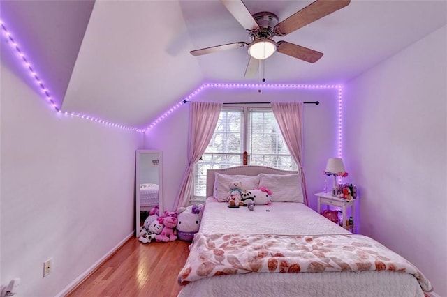 bedroom with lofted ceiling, ceiling fan, and light hardwood / wood-style floors