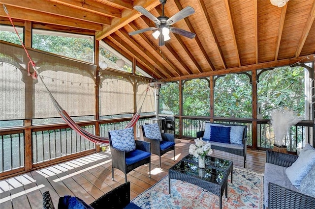 unfurnished sunroom with wooden ceiling, ceiling fan, and vaulted ceiling with beams