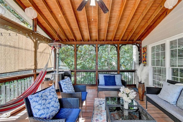 sunroom featuring wooden ceiling, ceiling fan, and vaulted ceiling with beams