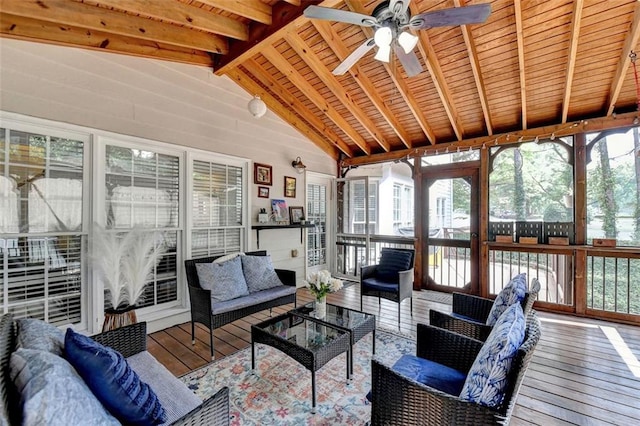 sunroom / solarium with wood ceiling, plenty of natural light, ceiling fan, and vaulted ceiling with beams